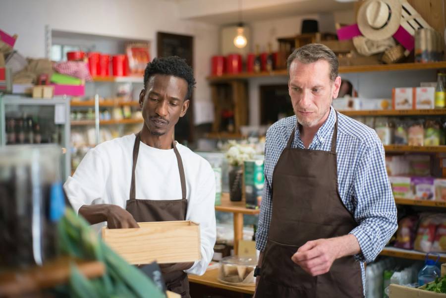 Two store sellers managing inventory